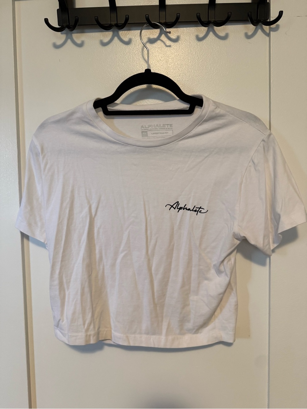 Alphalete White Crop Tee with Small Black Script Logo